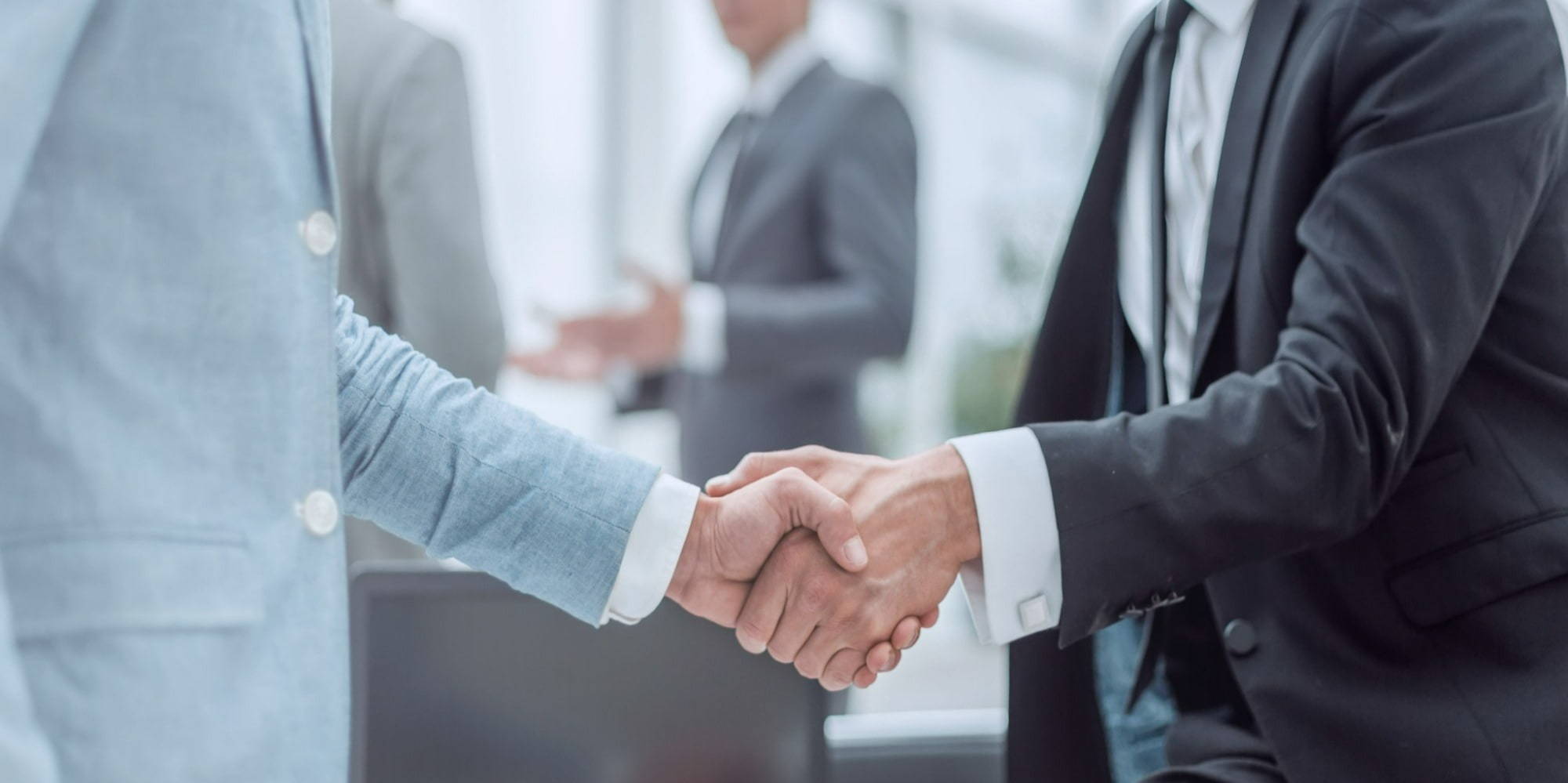 Shutterstock_businessman handshake aurora talent 